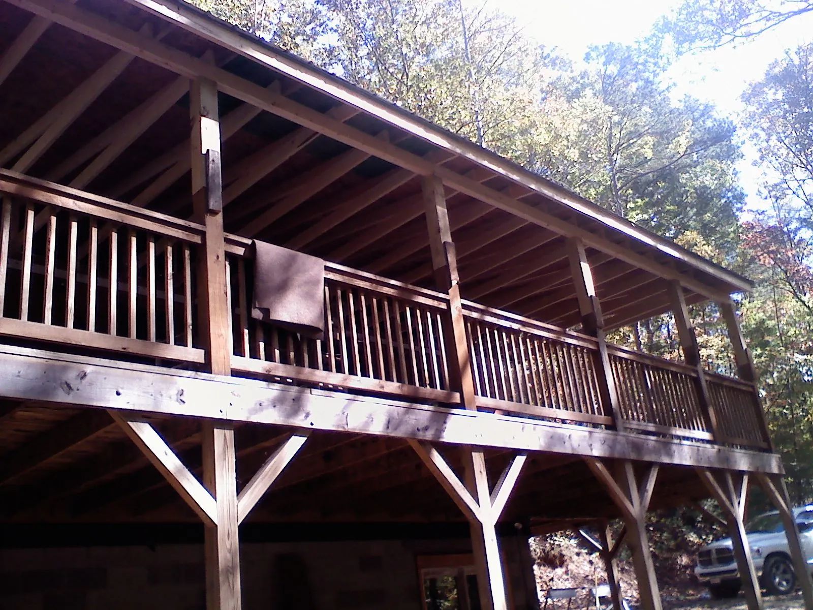 Timber framing under a new elevated porch and deck in Little Orleans